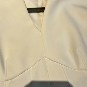 DKNY sleeveless sheath dress V neck. Hidden zipper, back slit. Size 2 in white.